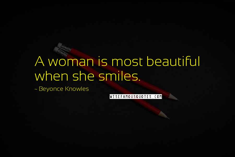 Beyonce Knowles Quotes: A woman is most beautiful when she smiles.