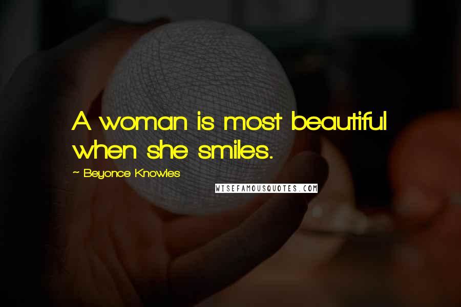 Beyonce Knowles Quotes: A woman is most beautiful when she smiles.