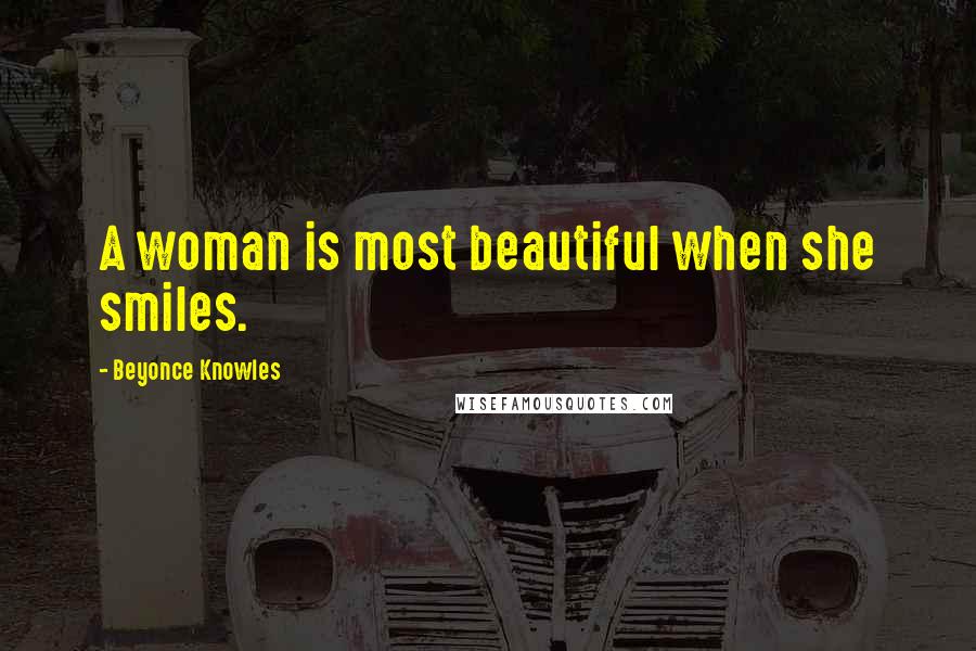 Beyonce Knowles Quotes: A woman is most beautiful when she smiles.