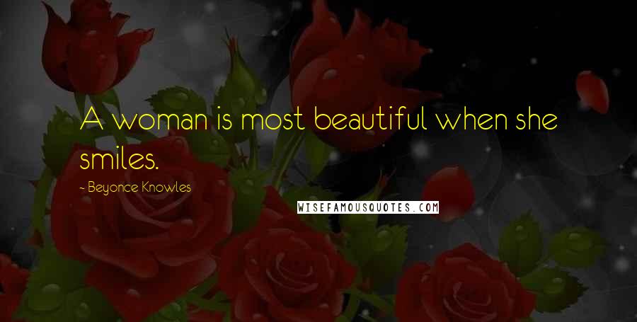 Beyonce Knowles Quotes: A woman is most beautiful when she smiles.