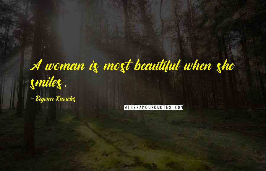 Beyonce Knowles Quotes: A woman is most beautiful when she smiles.