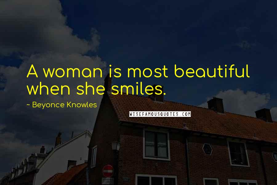 Beyonce Knowles Quotes: A woman is most beautiful when she smiles.