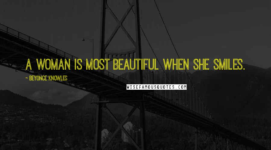 Beyonce Knowles Quotes: A woman is most beautiful when she smiles.