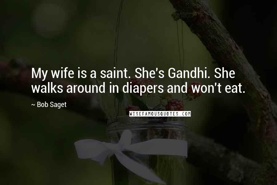 Bob Saget Quotes: My wife is a saint. She's Gandhi. She walks around in diapers and won't eat.