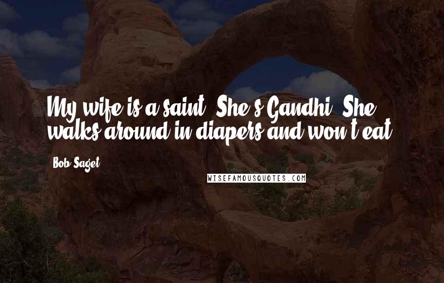 Bob Saget Quotes: My wife is a saint. She's Gandhi. She walks around in diapers and won't eat.