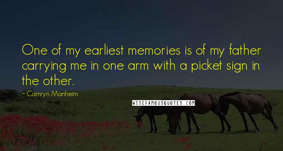 Camryn Manheim Quotes: One of my earliest memories is of my father carrying me in one arm with a picket sign in the other.