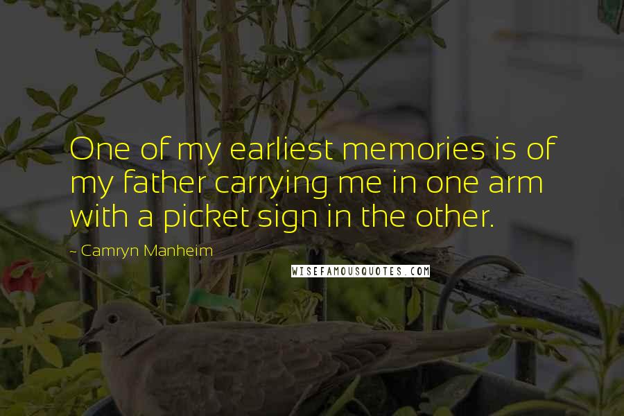 Camryn Manheim Quotes: One of my earliest memories is of my father carrying me in one arm with a picket sign in the other.