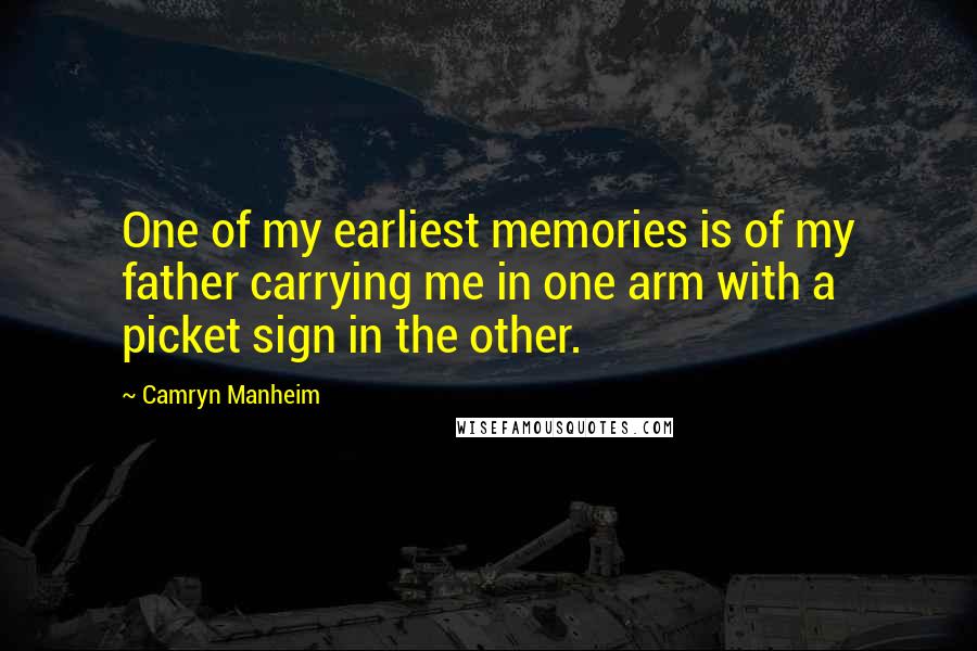 Camryn Manheim Quotes: One of my earliest memories is of my father carrying me in one arm with a picket sign in the other.