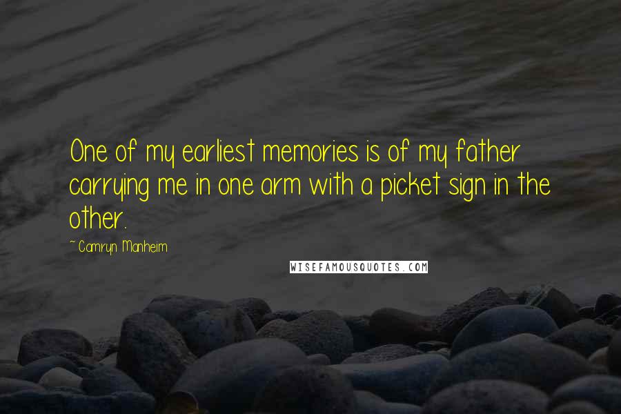 Camryn Manheim Quotes: One of my earliest memories is of my father carrying me in one arm with a picket sign in the other.