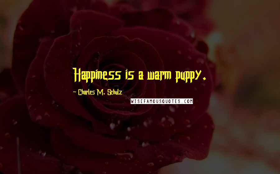 Charles M. Schulz Quotes: Happiness is a warm puppy.