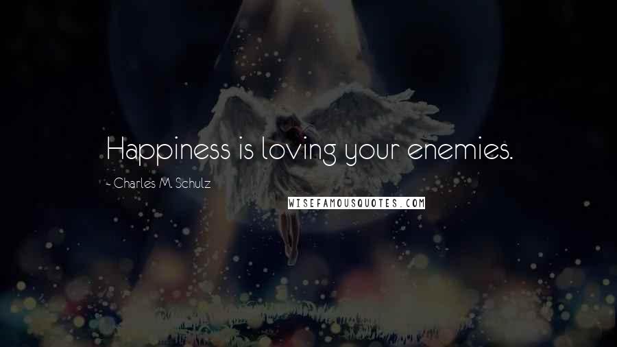 Charles M. Schulz Quotes: Happiness is loving your enemies.