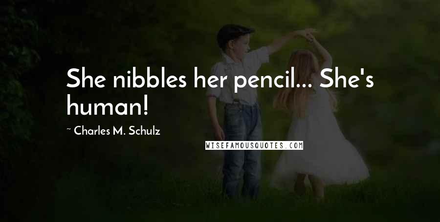 Charles M. Schulz Quotes: She nibbles her pencil... She's human!