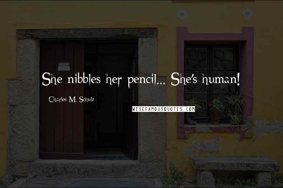 Charles M. Schulz Quotes: She nibbles her pencil... She's human!