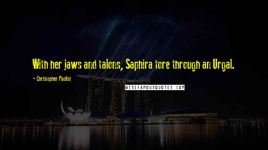 Christopher Paolini Quotes: With her jaws and talons, Saphira tore through an Urgal.