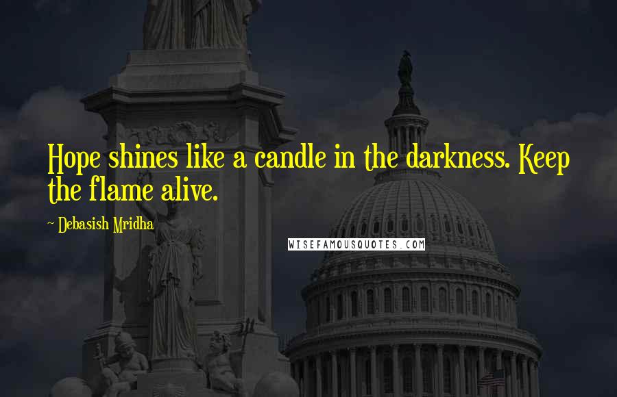 Debasish Mridha Quotes: Hope shines like a candle in the darkness. Keep the flame alive.