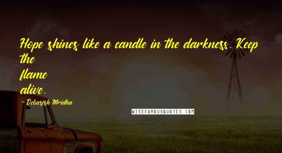 Debasish Mridha Quotes: Hope shines like a candle in the darkness. Keep the flame alive.