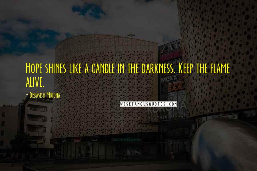 Debasish Mridha Quotes: Hope shines like a candle in the darkness. Keep the flame alive.