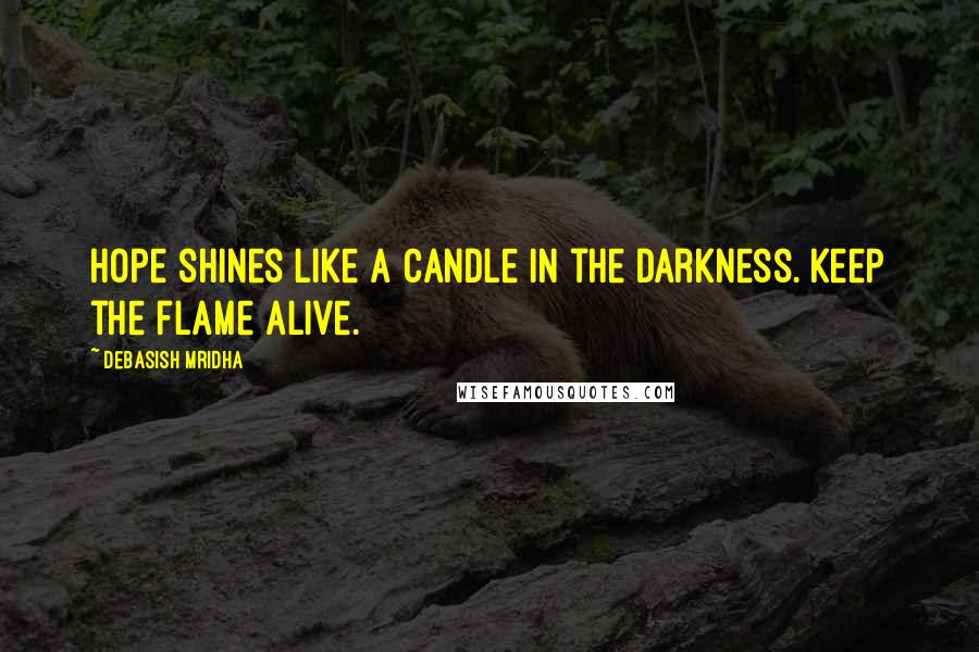 Debasish Mridha Quotes: Hope shines like a candle in the darkness. Keep the flame alive.