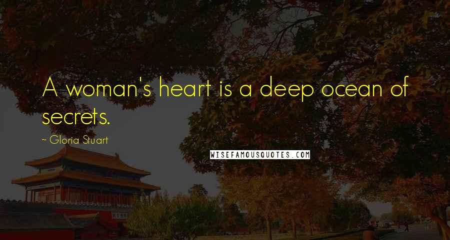 Gloria Stuart Quotes: A woman's heart is a deep ocean of secrets.