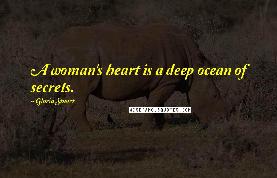 Gloria Stuart Quotes: A woman's heart is a deep ocean of secrets.