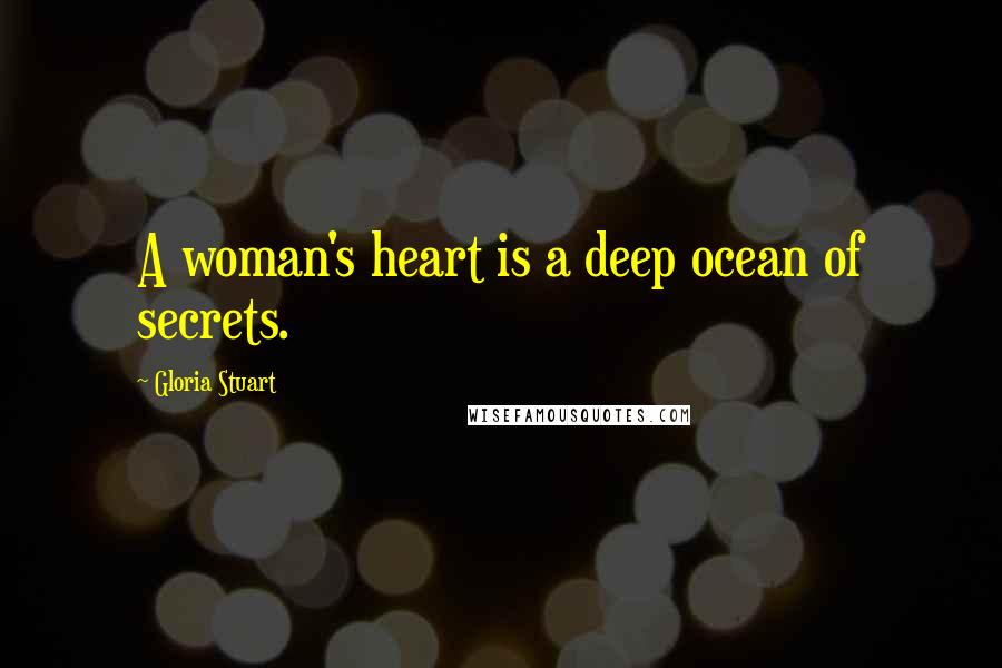 Gloria Stuart Quotes: A woman's heart is a deep ocean of secrets.