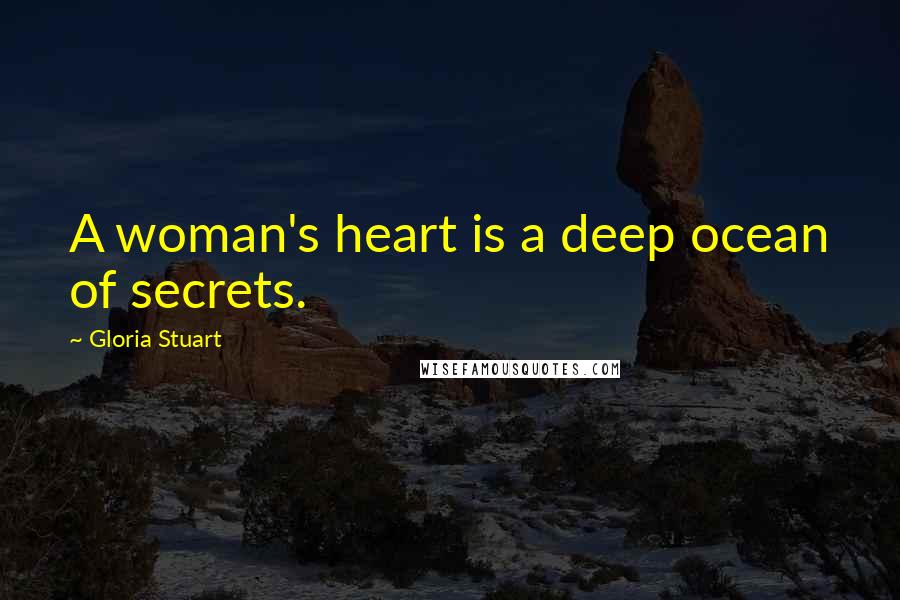 Gloria Stuart Quotes: A woman's heart is a deep ocean of secrets.