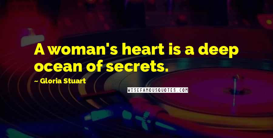 Gloria Stuart Quotes: A woman's heart is a deep ocean of secrets.