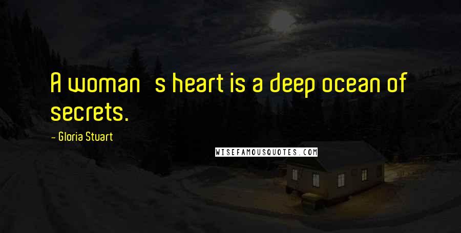 Gloria Stuart Quotes: A woman's heart is a deep ocean of secrets.