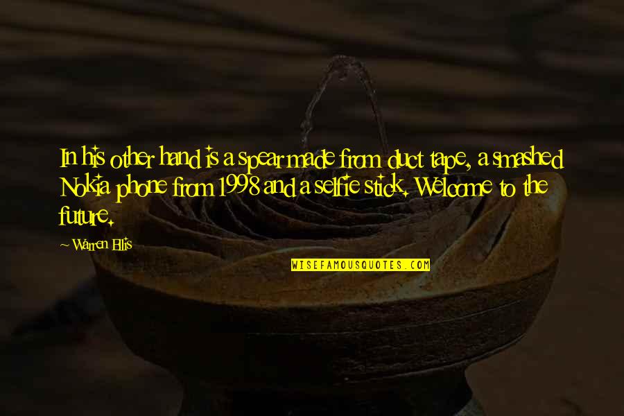 1998 S Quotes By Warren Ellis: In his other hand is a spear made