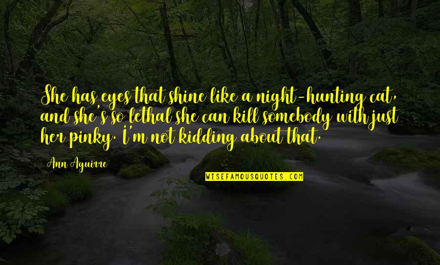 A Cat's Eyes Quotes By Ann Aguirre: She has eyes that shine like a night-hunting