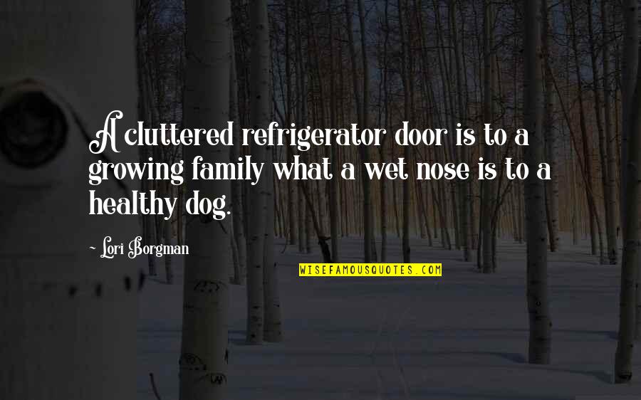 A Family Growing Quotes By Lori Borgman: A cluttered refrigerator door is to a growing
