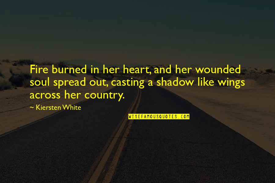 A Strong Soul Quotes By Kiersten White: Fire burned in her heart, and her wounded A Strong Soul Quotes By Kiersten White: Fire burned in her heart, and her wounded