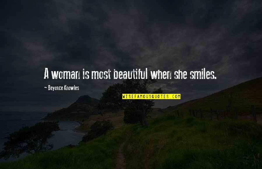 A Woman Beauty Quotes By Beyonce Knowles: A woman is most beautiful when she smiles.