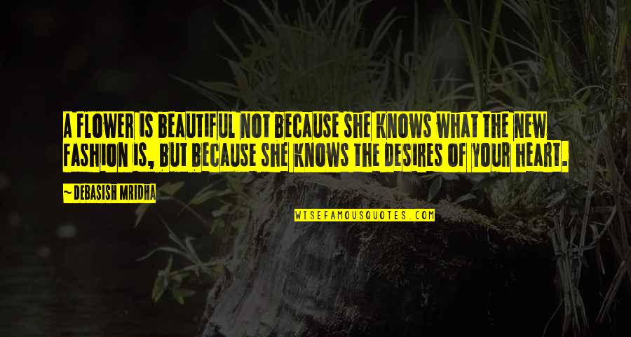 A Woman With A Beautiful Heart Quotes By Debasish Mridha: A flower is beautiful not because she knows