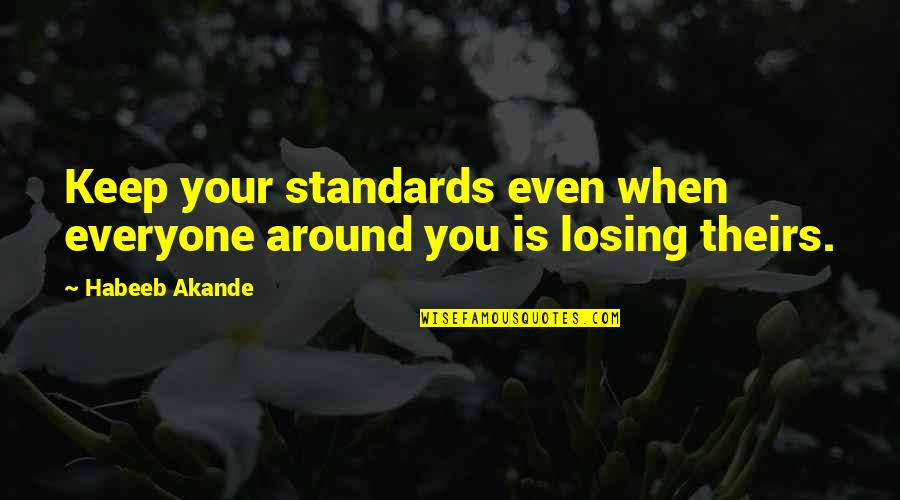 Aim For Success Quotes By Habeeb Akande: Keep your standards even when everyone around you