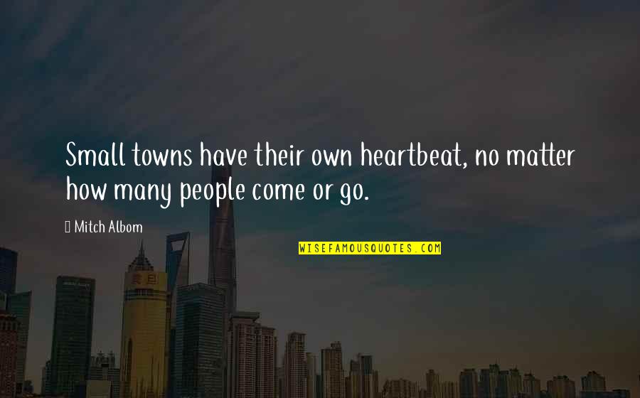 Amateurs Talk Tactics Quotes By Mitch Albom: Small towns have their own heartbeat, no matter