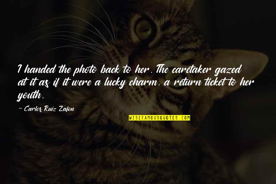Back Photo Quotes By Carlos Ruiz Zafon: I handed the photo back to her. The Back Photo Quotes By Carlos Ruiz Zafon: I handed the photo back to her. The