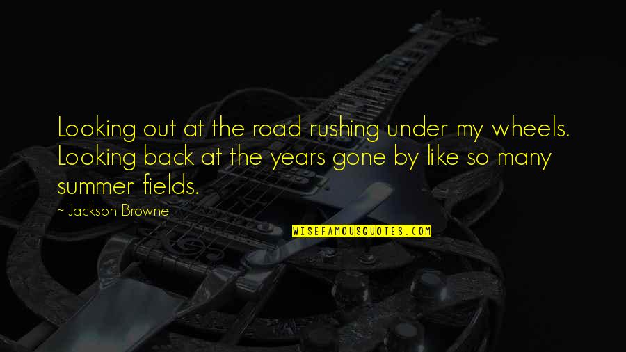 Back Road Quotes By Jackson Browne: Looking out at the road rushing under my