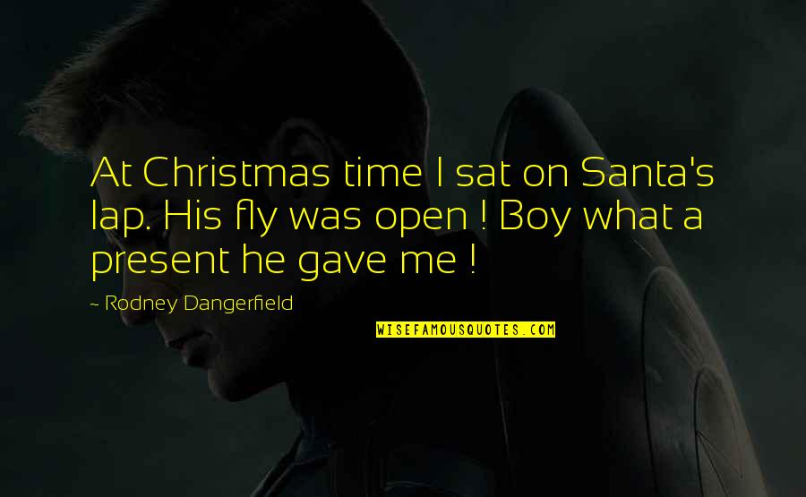 Boy Christmas Quotes By Rodney Dangerfield: At Christmas time I sat on Santa's lap.