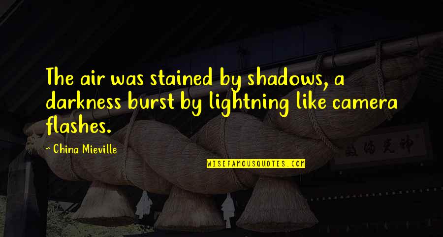Camera Flashes Quotes By China Mieville: The air was stained by shadows, a darkness