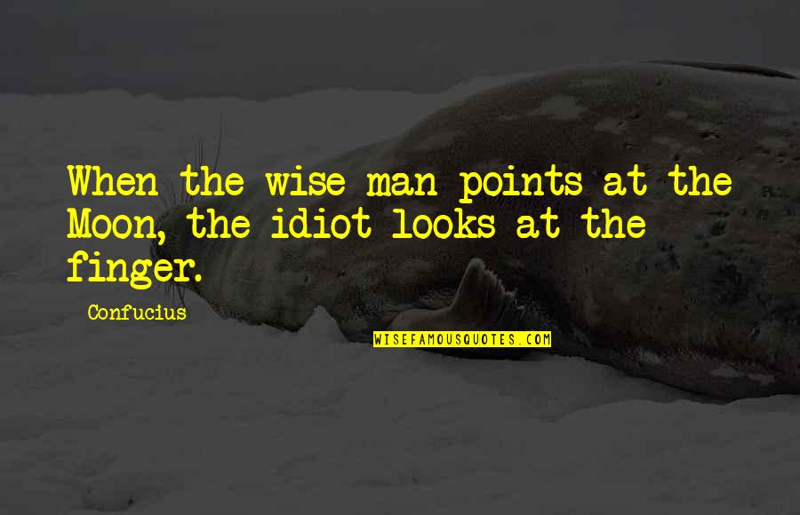 Cameroonian Quotes By Confucius: When the wise man points at the Moon,