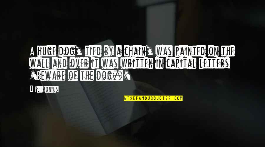 Capital Letters Within Quotes By Petronius: A huge dog, tied by a chain, was