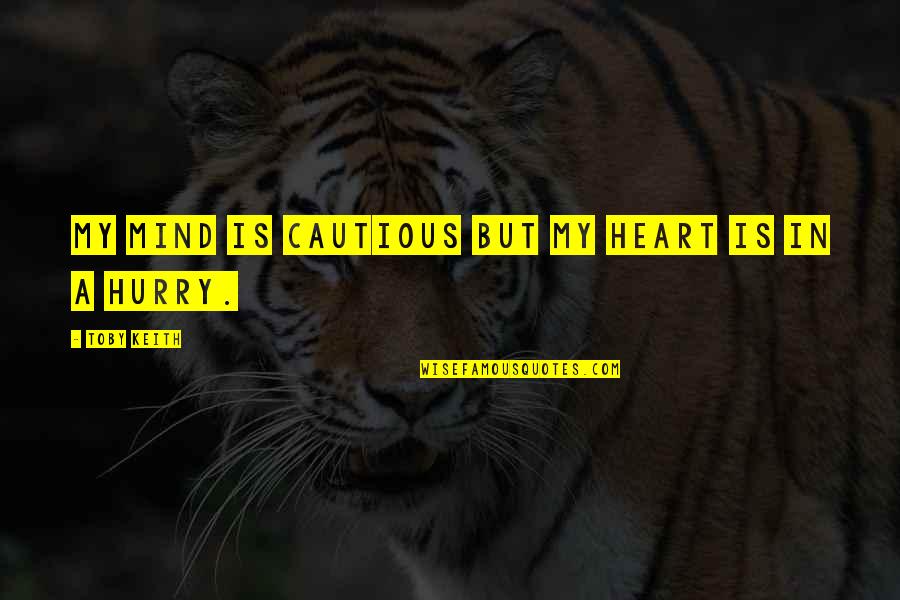 Cautious Heart Quotes By Toby Keith: My mind is cautious but my heart is