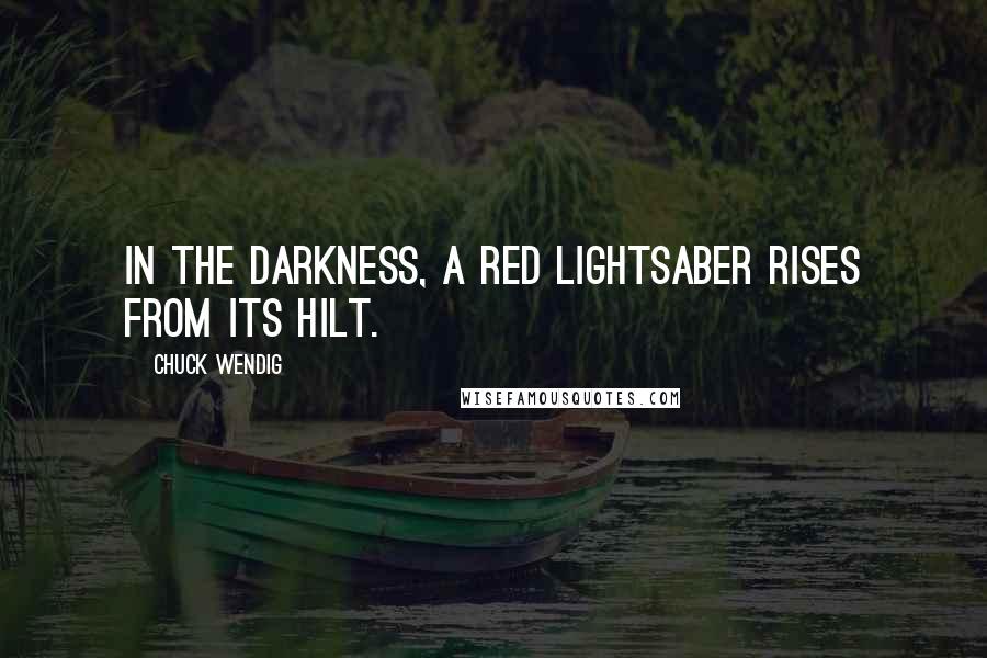 Chuck Wendig quotes: In the darkness, a red lightsaber rises from its hilt.