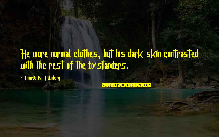 Ciaz Quotes By Charlie N. Holmberg: He wore normal clothes, but his dark skin Ciaz Quotes By Charlie N. Holmberg: He wore normal clothes, but his dark skin
