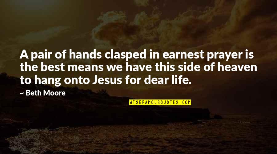 Clasped Quotes By Beth Moore: A pair of hands clasped in earnest prayer