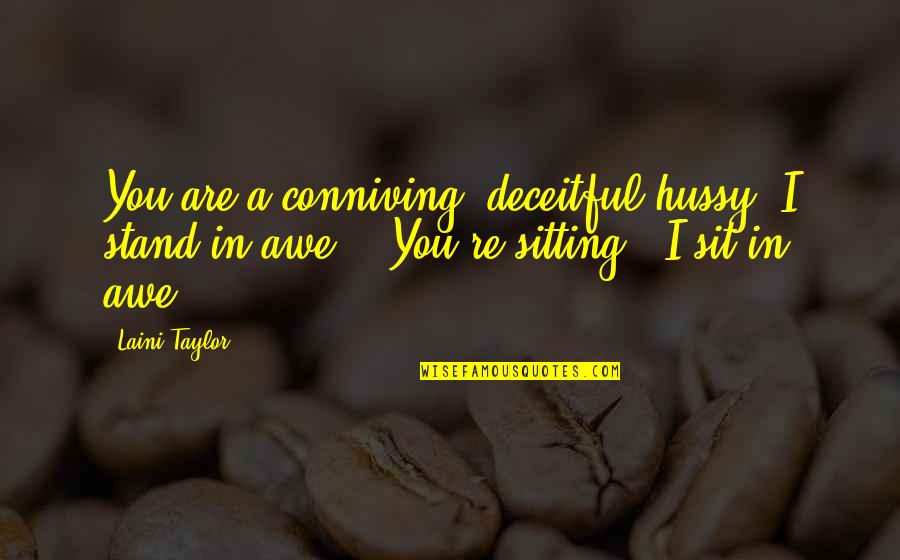 Conniving Quotes By Laini Taylor: You are a conniving, deceitful hussy. I stand