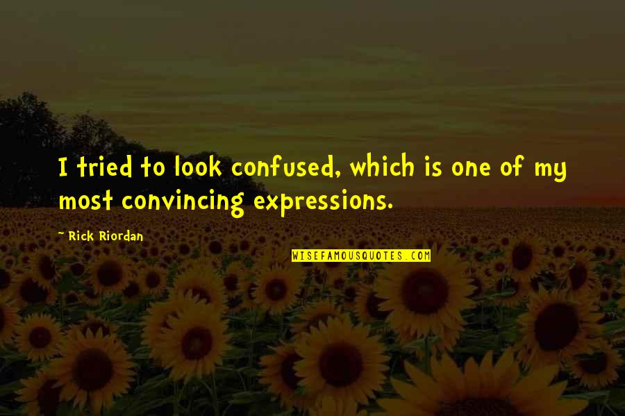 Convincing Quotes By Rick Riordan: I tried to look confused, which is one