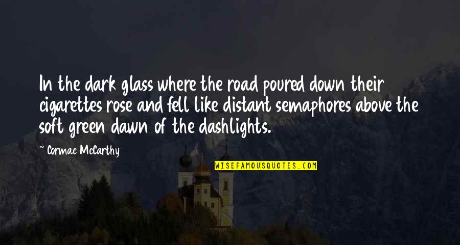 Cormac Mccarthy The Road Quotes By Cormac McCarthy: In the dark glass where the road poured