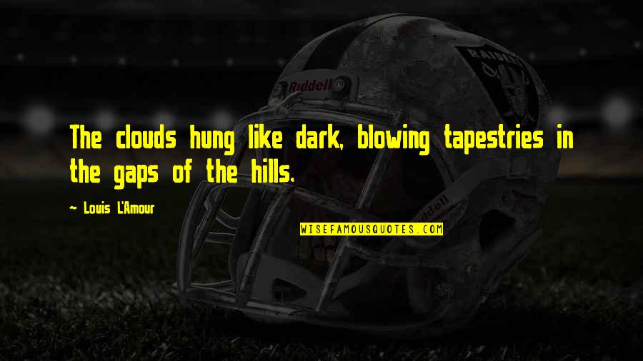 Dark Clouds Quotes By Louis L'Amour: The clouds hung like dark, blowing tapestries in